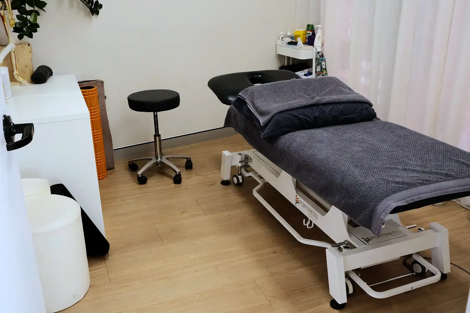 Treatment room at Pro Health Clinic with adjustment table